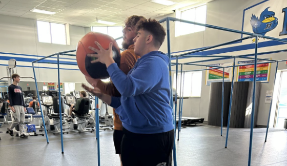 In the fitness center, Jack Heilman and his partner, Mason Howard, are passing a medicine ball back and forth. “They do this workout for their core, taking the medicine ball and wrapping it from shoulder to shoulder,” fitness teacher Jill Taylor said.
